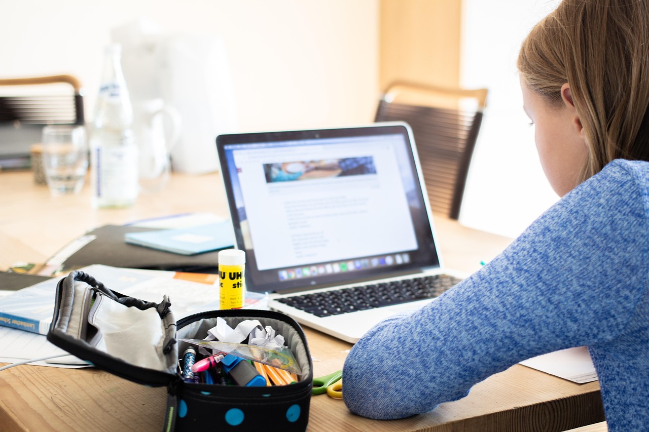 A learner studying at a laptop